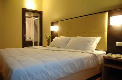Letto o letti in una camera di Hotel Alverì