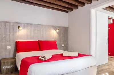 Letto o letti in una camera di Appartamento Rosso