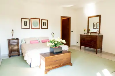 Letto o letti in una camera di Villa Paola
