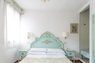 Letto o letti in una camera di Hotel Serenissima