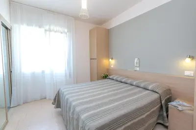 Letto o letti in una camera di Hotel Colonna