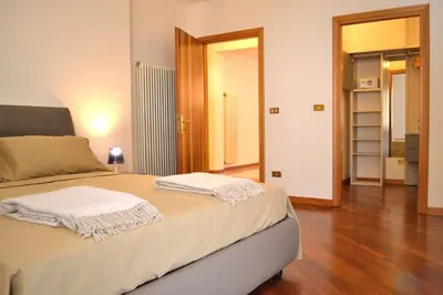 Letto o letti in una camera di Portico Oscuro Deluxe Apartment - centro città