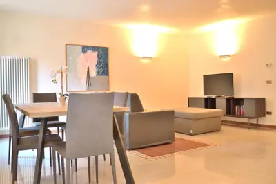 Area soggiorno di Portico Oscuro Deluxe Apartment - centro città