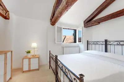 Letto o letti in una camera di CA MODERNA 2