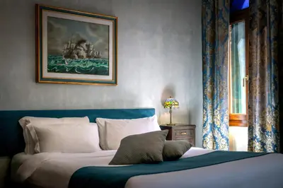 Letto o letti in una camera di Palazzo San Luca