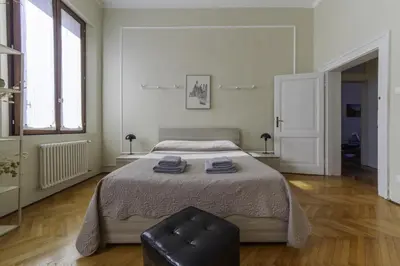 Letto o letti in una camera di TONIOLO VENICE ROOMS