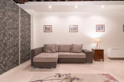 Area soggiorno di Riva Palace Apartments by Wonderful Italy