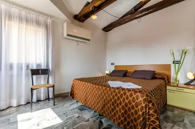 Letto o letti in una camera di Venice Apartments