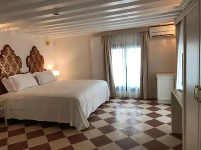 Letto o letti in una camera di Suites alla Maddalena