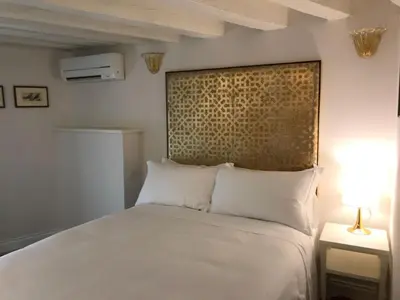 Letto o letti in una camera di Suites alla Maddalena