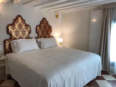 Letto o letti in una camera di Suites alla Maddalena