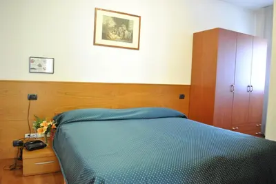 Letto o letti in una camera di Rometta Hotel