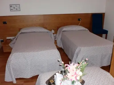 Letto o letti in una camera di Rometta Hotel