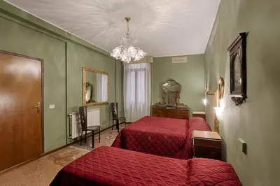 Letto o letti in una camera di Hotel Guerrato