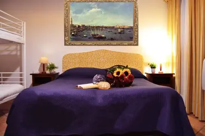 Letto o letti in una camera di Art Dreams Apartment Teatro Italia