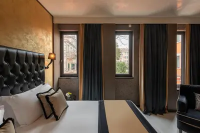 Letto o letti in una camera di Carnival Palace - Venice Collection