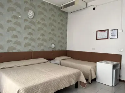 Letto o letti in una camera di Hotel Touring