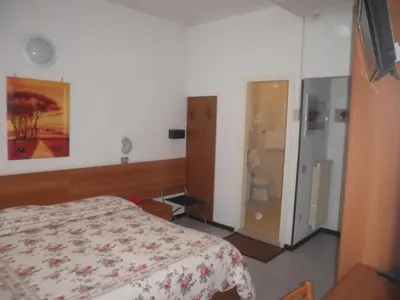 Letto o letti in una camera di Hotel Touring
