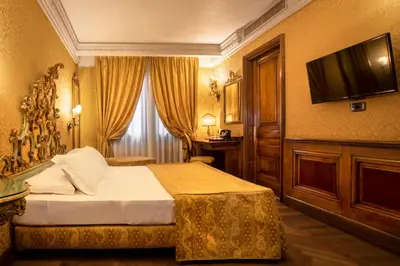 Letto o letti in una camera di Palazzina Veneziana