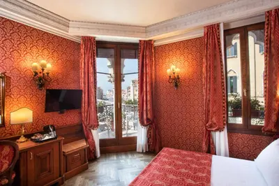 Letto o letti in una camera di Palazzina Veneziana