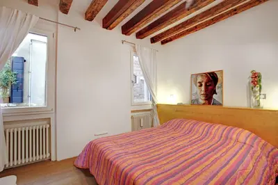 Letto o letti in una camera di Fenix Otello Apartments