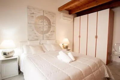 Letto o letti in una camera di Stella Marina 2