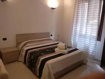 Letto o letti in una camera di alla lista