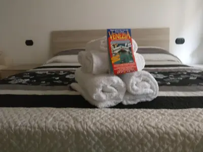 Letto o letti in una camera di alla lista