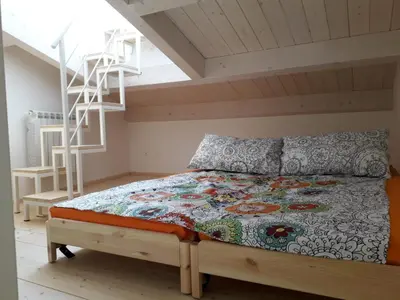 Letto o letti in una camera di Mansarda Settimo Cielo