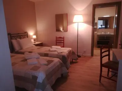 Letto o letti in una camera di La Libellula