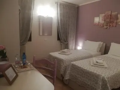 Letto o letti in una camera di La Libellula