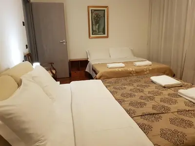 Letto o letti in una camera di Rosa Garden B&B