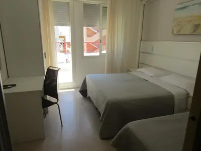 Letto o letti in una camera di Hotel Atene