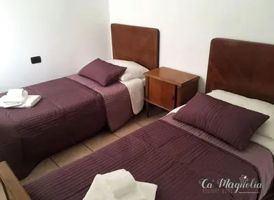 Letto o letti in una camera di Ca'Magnolia