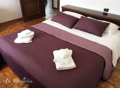 Letto o letti in una camera di Ca'Magnolia