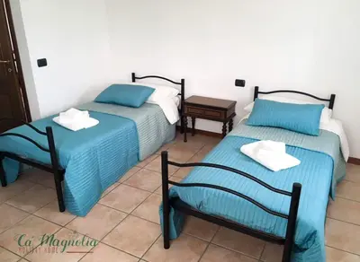 Letto o letti in una camera di Ca'Magnolia