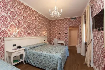 Letto o letti in una camera di Charming Palace Santa Fosca