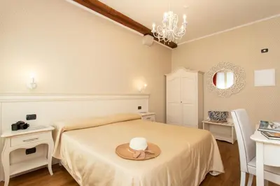 Letto o letti in una camera di Charming Palace Santa Fosca