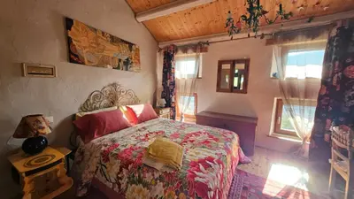 Letto o letti in una camera di Poggio del Sole