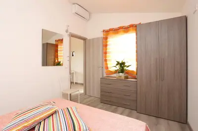 Letto o letti in una camera di Villaggio Olmè