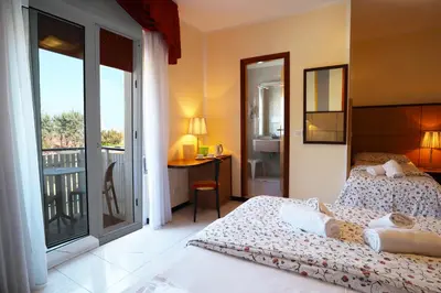 Letto o letti in una camera di Hotel Righetto Fronte Mare