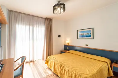 Letto o letti in una camera di Hotel Souvenir