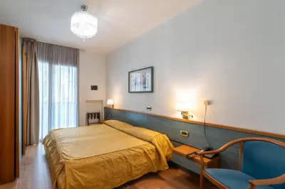 Letto o letti in una camera di Hotel Souvenir