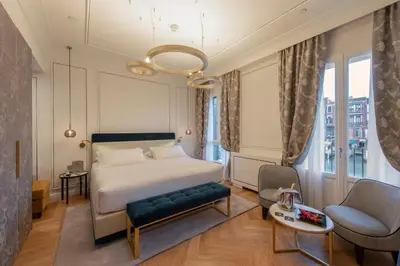 Letto o letti in una camera di H10 Palazzo Canova