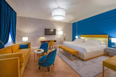 Letto o letti in una camera di H10 Palazzo Canova