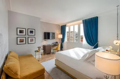 Letto o letti in una camera di H10 Palazzo Canova