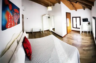 Letto o letti in una camera di LOCANDA RIGHETTO