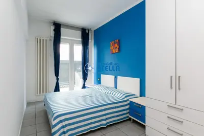 Letto o letti in una camera di Condominio Milan