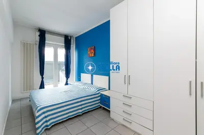 Letto o letti in una camera di Condominio Milan
