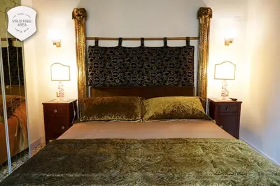 Letto o letti in una camera di Granda Sweet Suites